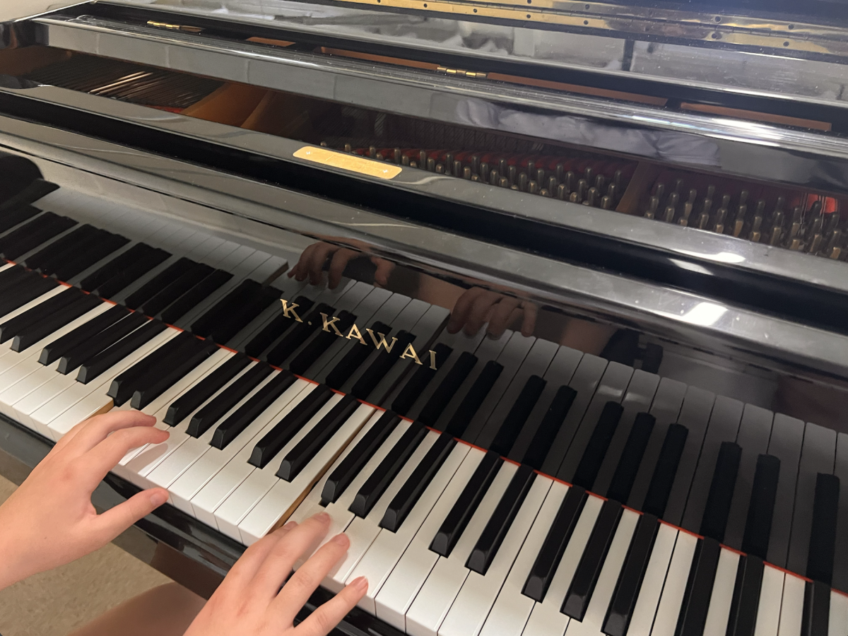 Sophomore Margo Gallegos plays the piano in the  choir room.